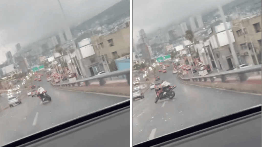 a causa del pavimento resbaladizo un motociclista se cae en plena avenida