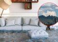 Living room flooded with water up to the sofa; a circular inset shows a distant mountainous skyline and cityscape in red outline.